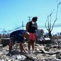 Fire survivors looking through the ashes and rubble for their belongings